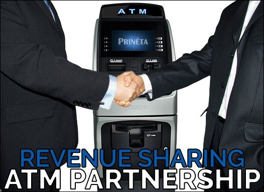 two businessmen handshake in front of ATM machine