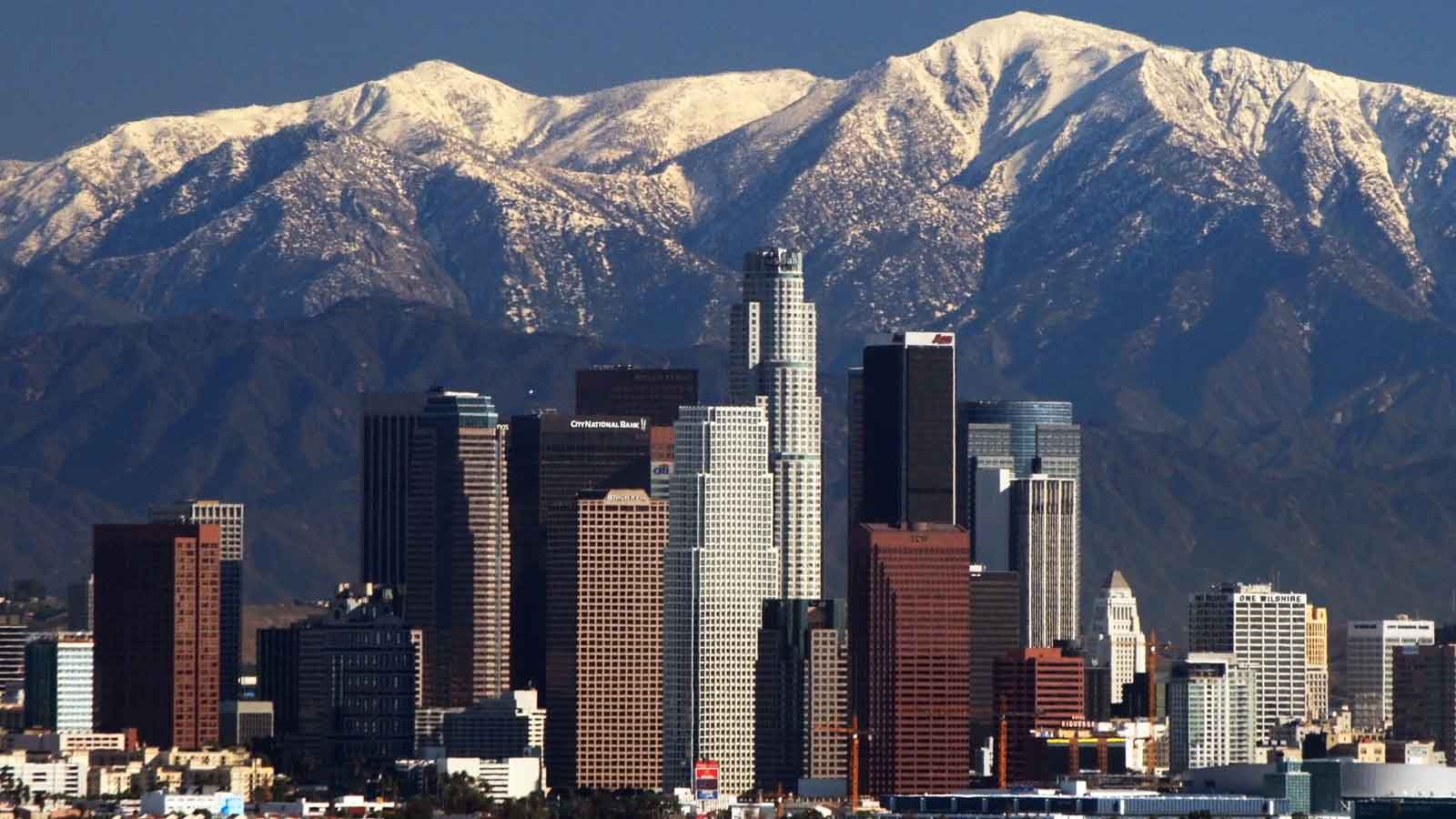 los angeles skyline with white cap mountains