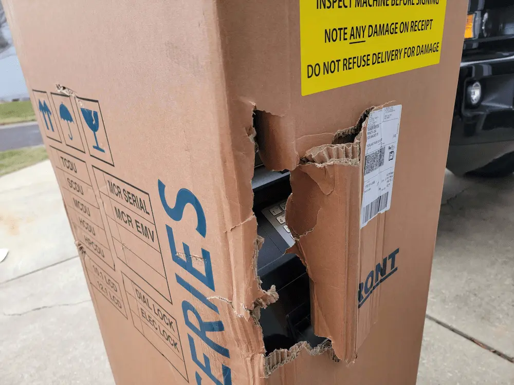 ATM shipment box with major damage. 